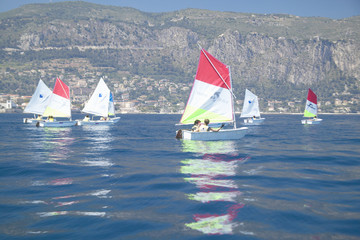 Fototapeta premium Children in sailing school in port at Saint Jean Cap Ferrat, French Riviera, France