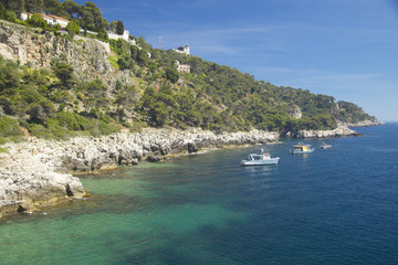 Boats docked near hillside on French Riviera, France