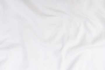 Fototapeta premium Abstract white fabric texture background. Wavy white cloth.