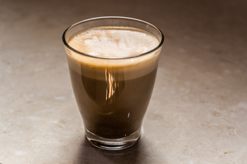 A glass of Cappuccino coffee