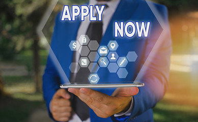 Text sign showing Apply Now. Business photo text An act of a demonstrating to acquire the job...