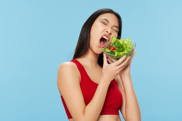 young woman eating salad