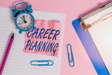 Text sign showing Career Planning. Business photo text Strategically plan your career goals and work success Paper sheet note clipboard pencil clips alarm clock colored background