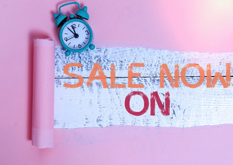 Writing note showing Sale Now On. Business concept for Discounts and promotional sales retail...