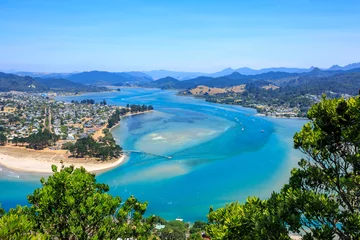 Foto op Canvas The neighboring coastal towns of Pauanui (left) and Tairua (right), separated by Tairua Harbour, on the Coromandel Peninsula, New Zealand © Michael