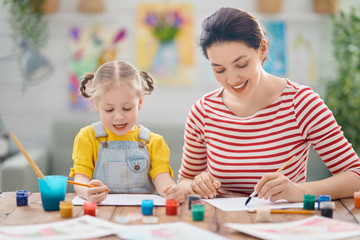 Fototapeta premium Happy family painting together.