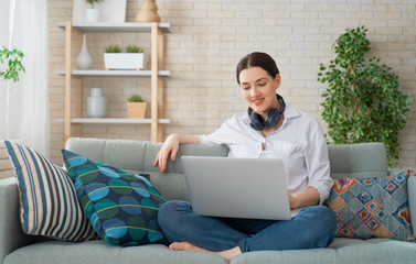 Woman working on a laptop.