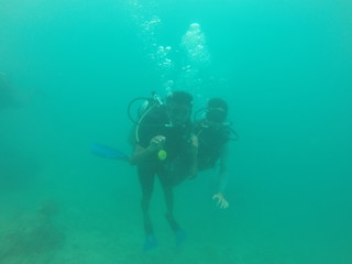 Fototapeta na wymiar Bunch of scuba divers under water