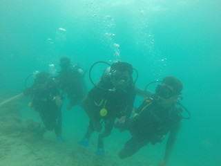 Fototapeta na wymiar Bunch of scuba divers under water