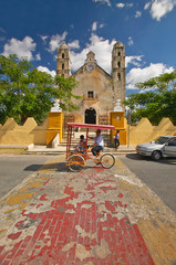 Bicycle taxi in front of Catholic cathedral of Izamal, Yucatan Peninsula, Mexico
