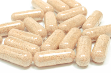 Medicine pills or capsules on white background