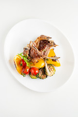 Modern French cuisine: Roasted Lamb neck & rack served with carrot, yellow curry and lamb sauce.