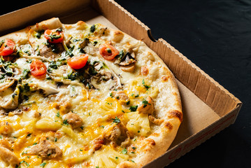 pizza on the black background