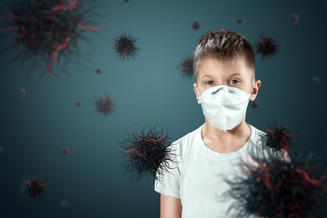 A child boy in a mask protects himself from virus particles flying in the air. Coronavirus,...