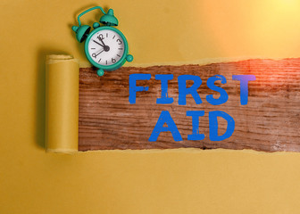 Text sign showing First Aid. Business photo showcasing Practise of healing small cuts that no need...