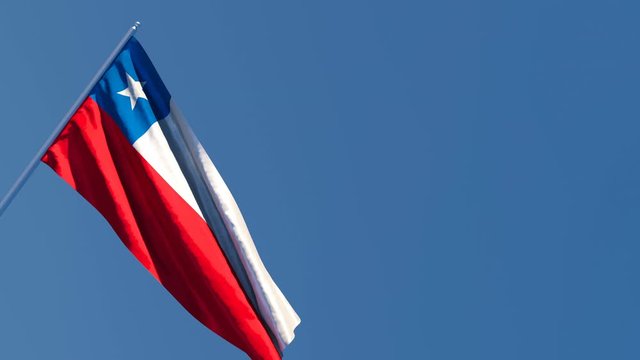 The national flag of Chile is flying in the wind