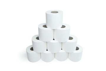 White toilet roll paper stacked in a pyramid shape. Angled shot from above, isolated on white with...