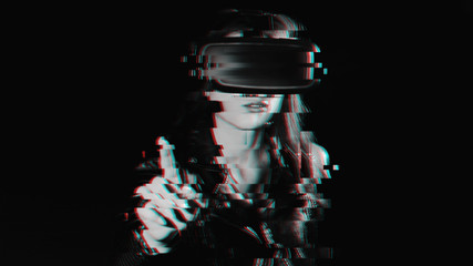 girl in modern virtual reality glasses on a black background