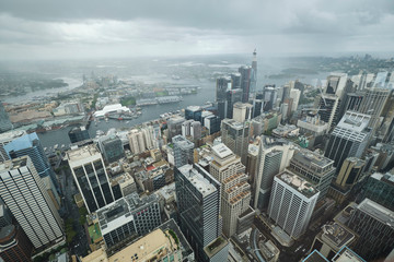 Fototapeta premium Overlooking Sydney CBD from tall viewing deck on grey sky overcast cloudy day