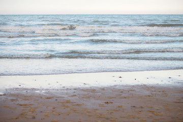 Sand beach and waves.
