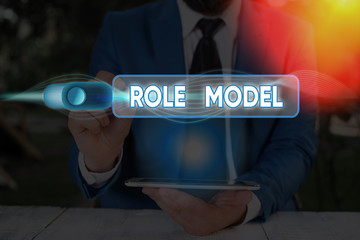 Writing note showing Role Model. Business concept for a demonstrating looked to by others as an...