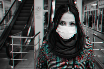 Concept of Corona virus. Girl in medical mask for protection from the epidemic COVID-19