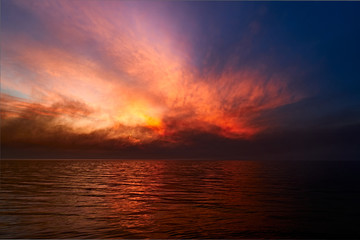 Sea sunset. Smoke wildfires sweeping across the sky.