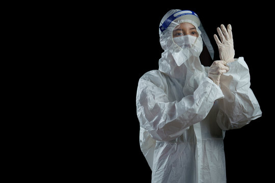 Doctor wearing ppe suit, face mask, surgical glove and face shield , Corona virus, Covid-19 virus outbreak concept black background