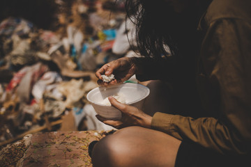 poor people or beggar begging you for help sitting at dirty slum.concept for poverty or hunger...