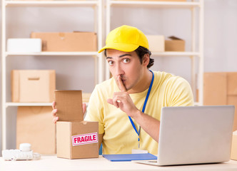 Handsome contractor working in box delivery relocation service