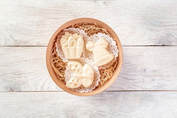 Fresh homemade butter in bowl, on wooden background. Top view. Rustic still-life