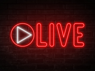 Live  - red neon light word on brick wall background 