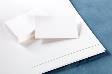 Blank business cards and a folder, a mock-up for a corporate style design presentation