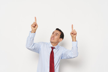 young businessman with arms raised