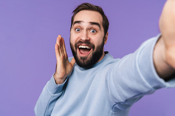 Fototapeta premium Handsome young man take a selfie by camera.