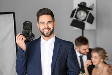 Portrait of male photographer in studio