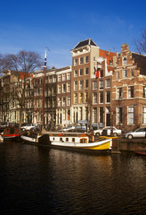 Fototapeta na wymiar Canals and houseboats in Amsterdam, Holland