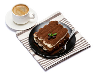 Classic tiramisu dessert on ceramic plate and cup of coffee isolated on white background with clipping path