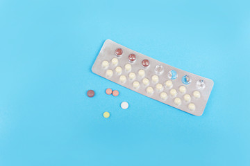 Contraception pills on blue background Birth control contraceptive means prevent pregnancy