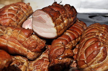 A large pieces of smoked bacon from pork. Smoked ham.