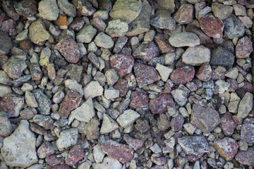 Crushed stone and multi-colored stones close-up element for the designer. Background like texture..