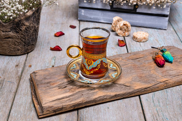 tea and cookie presentation on wooden floor