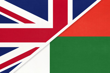 United Kingdom vs Madagascar national flag from textile. Relationship between two European and African countries.