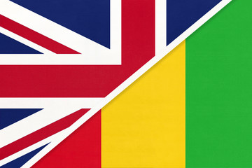 United Kingdom vs Guinea national flag from textile. Relationship between two European and African countries.