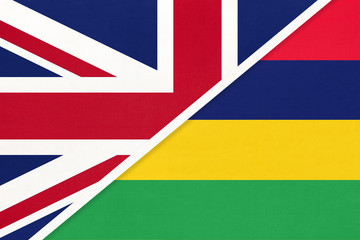 United Kingdom vs Mauritius national flag from textile. Relationship between two European and African countries.