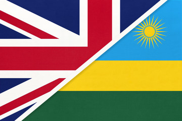 United Kingdom vs Rwanda national flag from textile. Relationship between two European and African countries.