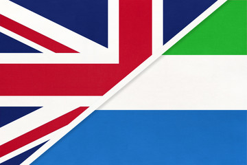 United Kingdom vs Sierra Leone national flag from textile. Relationship between two European and African countries.