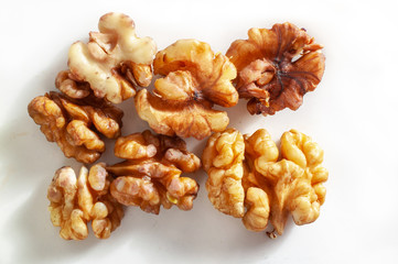 Peeled walnuts on a plate, an element of a healthy diet