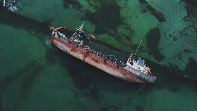 Tanker crashed on the shores of the Black Sea. Ecological disaster on the beaches of Odessa in Ukraine. The ship ran aground.  Environmental pollution at sea. Aerial view    