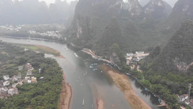 Aerial shot above Yangshuo Lijiang River Scenic Area at Xingping Village, Guangxi, China